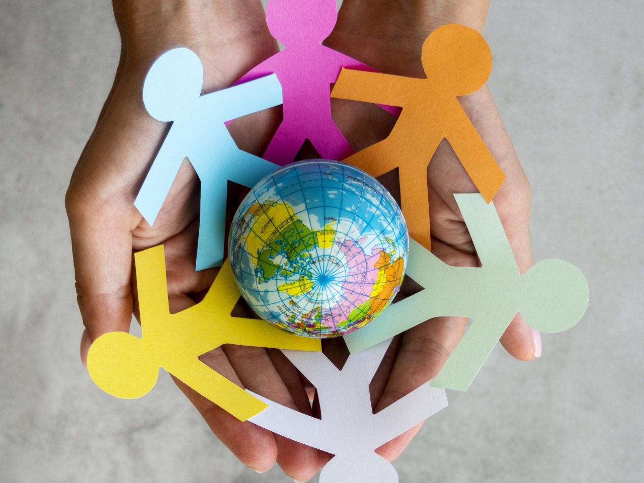 top-view-origami-chain-people-with-globe